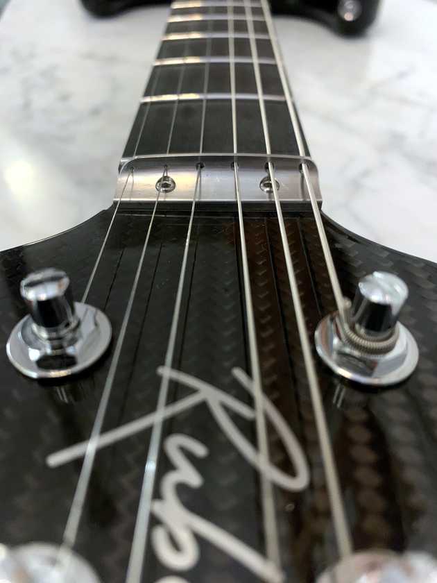 close up of the front of a carbon fibre guitar neck