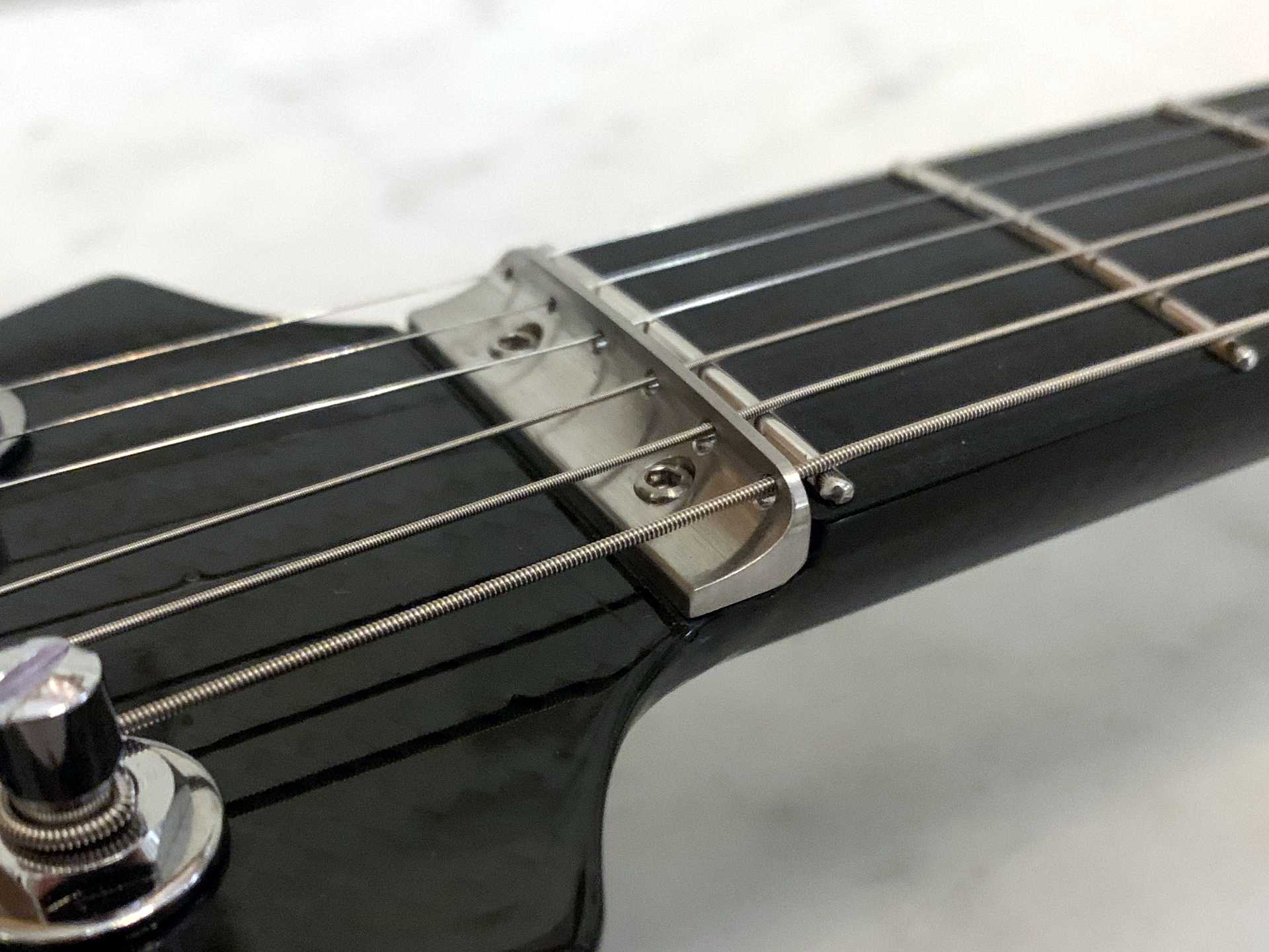 Stainless steel string guide